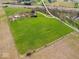 Expansive aerial view showcases the property's vast land and its proximity to the highway at 3308 S 600 E Rd, Waldron, IN 46182