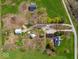 Aerial view of farm with home, outbuildings, and fields showcasing property layout at 3308 S 600 E Rd, Waldron, IN 46182