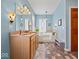 Spacious bathroom featuring a large soaking tub, double vanity, and decorative lighting at 3308 S 600 E Rd, Waldron, IN 46182