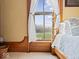 Bright bedroom with wooden frame window and scenic views of lush outdoor landscape at 3308 S 600 E Rd, Waldron, IN 46182