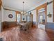 Charming dining room with beautiful hardwood floors, classic decor, and ample natural light at 3308 S 600 E Rd, Waldron, IN 46182