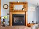 Close up of the fireplace with wood trim, decor, and brick features at 3308 S 600 E Rd, Waldron, IN 46182