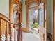 Grand foyer with wooden archways, a view to the entry door and a classic staircase at 3308 S 600 E Rd, Waldron, IN 46182
