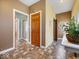 Hallway view of the home's interior showcasing the wood trim and several doorways at 3308 S 600 E Rd, Waldron, IN 46182