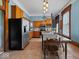 Bright kitchen with stainless steel appliances, granite countertops, and a large center island with seating at 3308 S 600 E Rd, Waldron, IN 46182