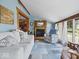 Cozy living room features a fireplace, large windows, and comfortable seating at 3308 S 600 E Rd, Waldron, IN 46182