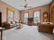 Spacious living room featuring large windows, comfortable seating, and classic design elements at 3308 S 600 E Rd, Waldron, IN 46182