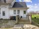 Charming rear exterior featuring a wooden deck and well-maintained yard at 3308 S 600 E Rd, Waldron, IN 46182