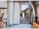 Light filled sun room features views of the backyard, soft curtains, and wood trim at 3308 S 600 E Rd, Waldron, IN 46182