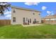 Wide backyard featuring furniture, patio, grill and the exterior of the home at 3511 Limesprings Ln, Whitestown, IN 46075