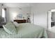 Airy bedroom with neutral walls, plush carpeting, a ceiling fan, and a comfortable queen-sized bed with light green covers at 3511 Limesprings Ln, Whitestown, IN 46075
