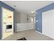 Bonus room with blue accent wall, laundry room, closet, and neutral carpet at 3511 Limesprings Ln, Whitestown, IN 46075