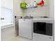 Laundry room with a washer and dryer plus shelving at 3511 Limesprings Ln, Whitestown, IN 46075