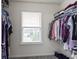 Well-organized walk-in closet with ample storage, featuring a window and plenty of hanging space for clothes and accessories at 3511 Limesprings Ln, Whitestown, IN 46075