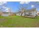 Spacious backyard featuring a wooden deck with outdoor seating, a storage shed, and a privacy fence at 3724 W 42Nd Ter, Indianapolis, IN 46228