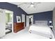 Comfortable bedroom featuring vaulted ceilings, neutral carpeting, and ensuite bathroom access at 3724 W 42Nd Ter, Indianapolis, IN 46228