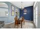 Dining room with wood table, chairs, chandelier, and luxury vinyl plank flooring at 3724 W 42Nd Ter, Indianapolis, IN 46228