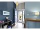 Entryway showcasing stylish two-tone paint, a blue front door, and modern decor at 3724 W 42Nd Ter, Indianapolis, IN 46228