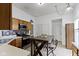 Warm kitchen with oak cabinetry, stainless steel appliances, and a breakfast table for casual dining at 3724 W 42Nd Ter, Indianapolis, IN 46228