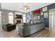 Living room with a ceiling fan, a brick fireplace, and views into the dining area at 3724 W 42Nd Ter, Indianapolis, IN 46228