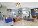 Inviting living room with modern decor, wood flooring, and an open layout to the dining area at 3724 W 42Nd Ter, Indianapolis, IN 46228