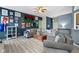 Open-concept living room with stylish decor, wood flooring, and plenty of seating at 3724 W 42Nd Ter, Indianapolis, IN 46228
