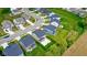 Aerial shot showing the home nestled in a well-planned community with tree-lined streets at 4941 Oak Hill Dr, Lebanon, IN 46052
