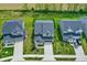 Aerial view of the neighborhood, showcasing a beautiful two-story home with well-manicured green lawns at 4941 Oak Hill Dr, Lebanon, IN 46052