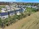 Aerial photograph displaying a friendly neighborhood with varied home designs and beautiful landscaping near a golf course at 4941 Oak Hill Dr, Lebanon, IN 46052