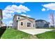 Backyard showcasing a partial fence, grass, and the home's exterior at 4941 Oak Hill Dr, Lebanon, IN 46052