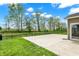 Spacious concrete patio with lush lawn, perfect for outdoor entertaining and relaxation at 4941 Oak Hill Dr, Lebanon, IN 46052