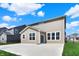 Exterior view of a backyard with patio space, partial fence and lawn at 4941 Oak Hill Dr, Lebanon, IN 46052