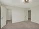 This bedroom features neutral colored walls, carpeted floors, and a walk-in closet at 4941 Oak Hill Dr, Lebanon, IN 46052