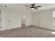 Neutral bedroom with carpeted floor, ceiling fan, and closet, provides a blank canvas for customization at 4941 Oak Hill Dr, Lebanon, IN 46052