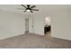 Spacious bedroom with ceiling fan and neutral carpet leads to ensuite bathroom at 4941 Oak Hill Dr, Lebanon, IN 46052