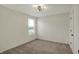 Bright bedroom featuring neutral carpet, a window, and a modern ceiling fan at 4941 Oak Hill Dr, Lebanon, IN 46052