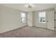 This bedroom features neutral colored walls, carpeted floors, and dual windows to let in natural light at 4941 Oak Hill Dr, Lebanon, IN 46052