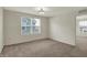 This bedroom features neutral colored walls, carpeted floors, and a ceiling fan with lighting at 4941 Oak Hill Dr, Lebanon, IN 46052