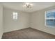 Bedroom featuring a window, plush carpet, neutral walls, and a modern ceiling fan at 4941 Oak Hill Dr, Lebanon, IN 46052