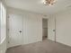 This bedroom features neutral colored walls, carpeted floors, and two closets at 4941 Oak Hill Dr, Lebanon, IN 46052