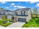 Beautiful two-story home with a two-car garage, manicured front lawn, and professional landscaping at 4941 Oak Hill Dr, Lebanon, IN 46052