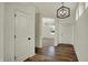 Bright foyer with wood floors, modern lighting, and white doors at 4941 Oak Hill Dr, Lebanon, IN 46052