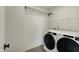 Laundry room with modern appliances and wire shelving for storage at 4941 Oak Hill Dr, Lebanon, IN 46052