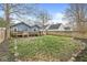 Backyard with a wooden deck and fenced yard at 5028 Graceland Ave, Indianapolis, IN 46208