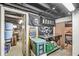 View of a finished basement space featuring workout equipment and ample storage containers at 5028 Graceland Ave, Indianapolis, IN 46208