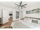 Bright bedroom with ensuite access, hardwood floors, and ceiling fan at 5028 Graceland Ave, Indianapolis, IN 46208