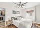 Bright bedroom with large windows, ceiling fan, walk-in closet and hardwood floors at 5028 Graceland Ave, Indianapolis, IN 46208