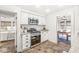 Eat-in kitchen featuring stainless steel appliances, granite countertops, and lots of natural light at 5028 Graceland Ave, Indianapolis, IN 46208