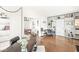 Open living area featuring hardwood floors, built-in shelving, and comfortable gray seating at 5028 Graceland Ave, Indianapolis, IN 46208
