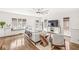 Living room featuring bright windows, window seating, hardwood floors, ceiling fan and stylish decor at 5028 Graceland Ave, Indianapolis, IN 46208